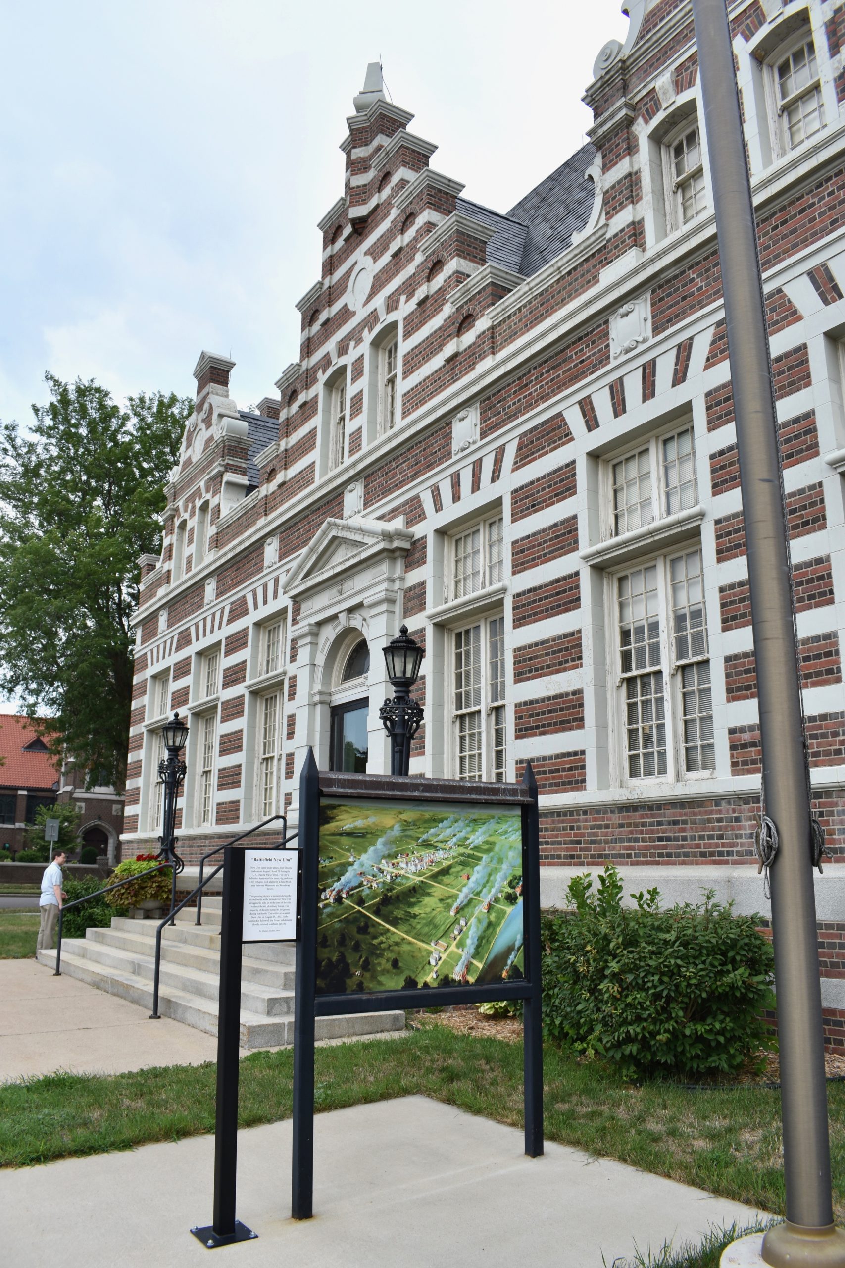 Brown County Historical Museum building exterior. Informational plaque in foreground.