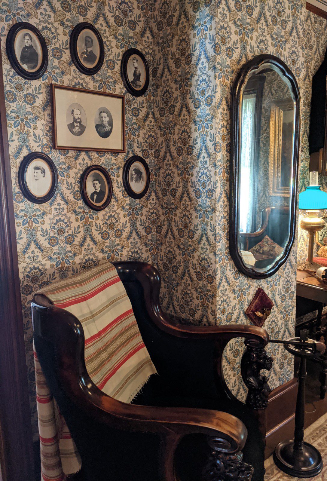 Cox Family portraits hung on wall