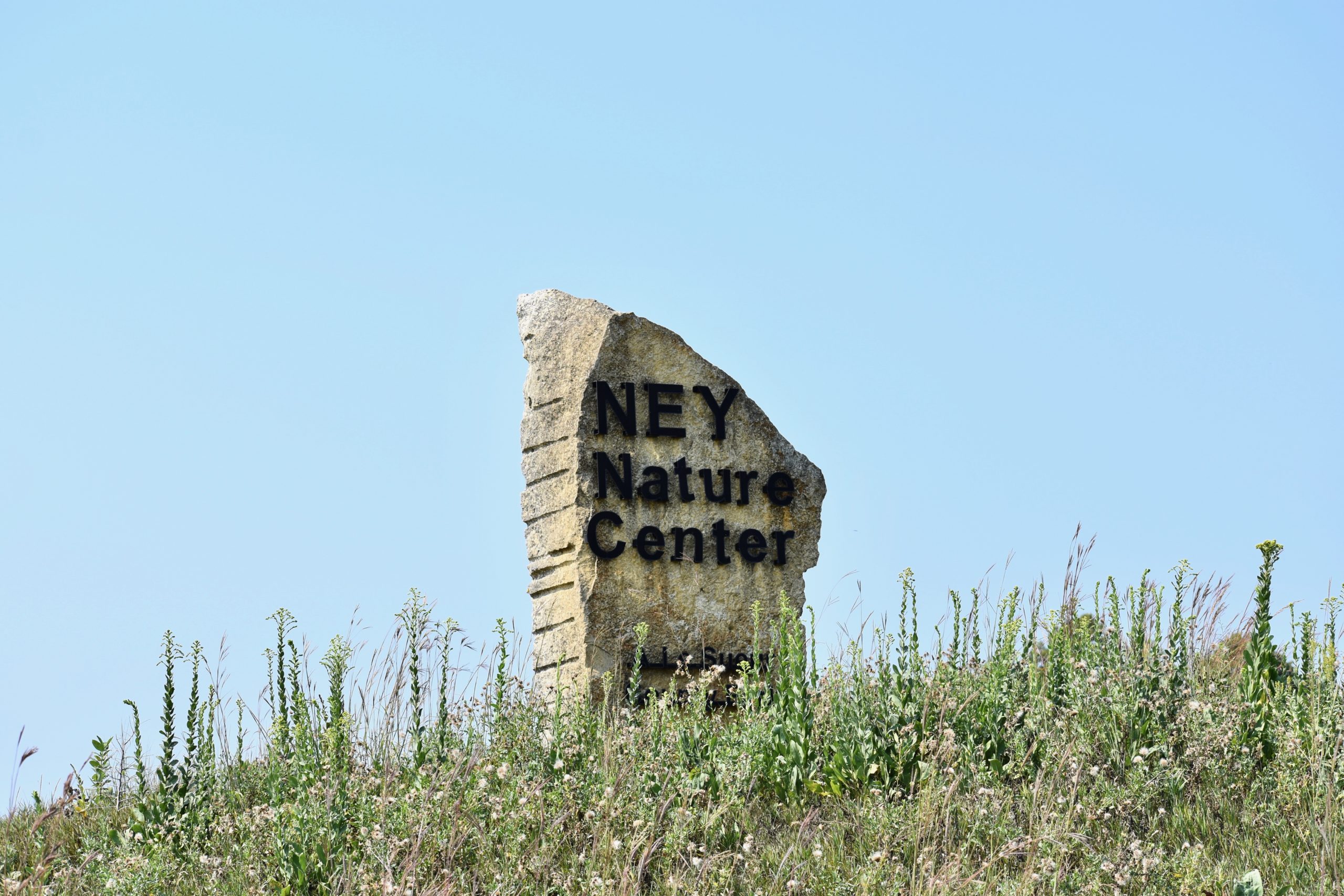Ney Nature Center printed on a rock
