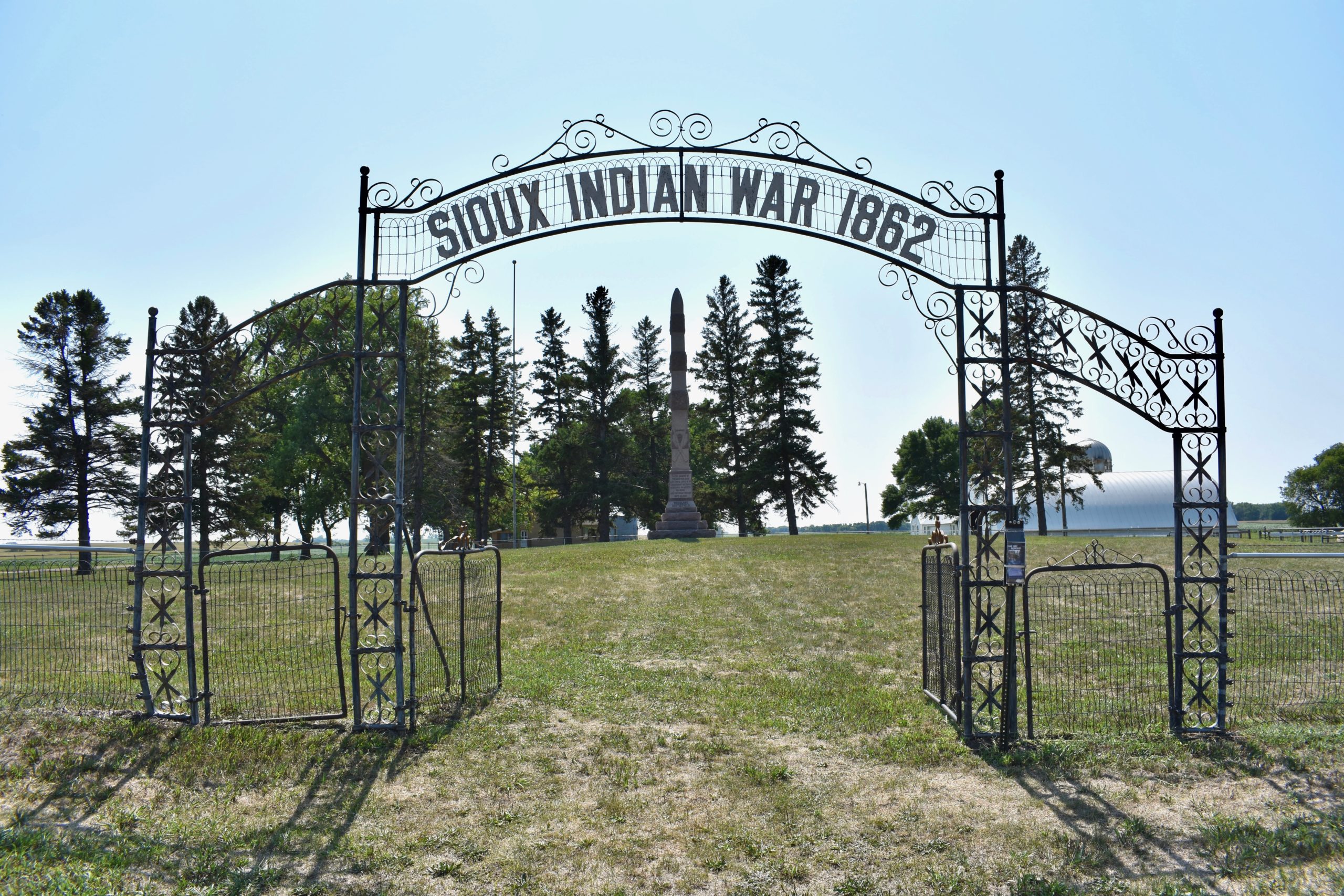 Sioux Indian War 1862 sign in foreground. Monument in background