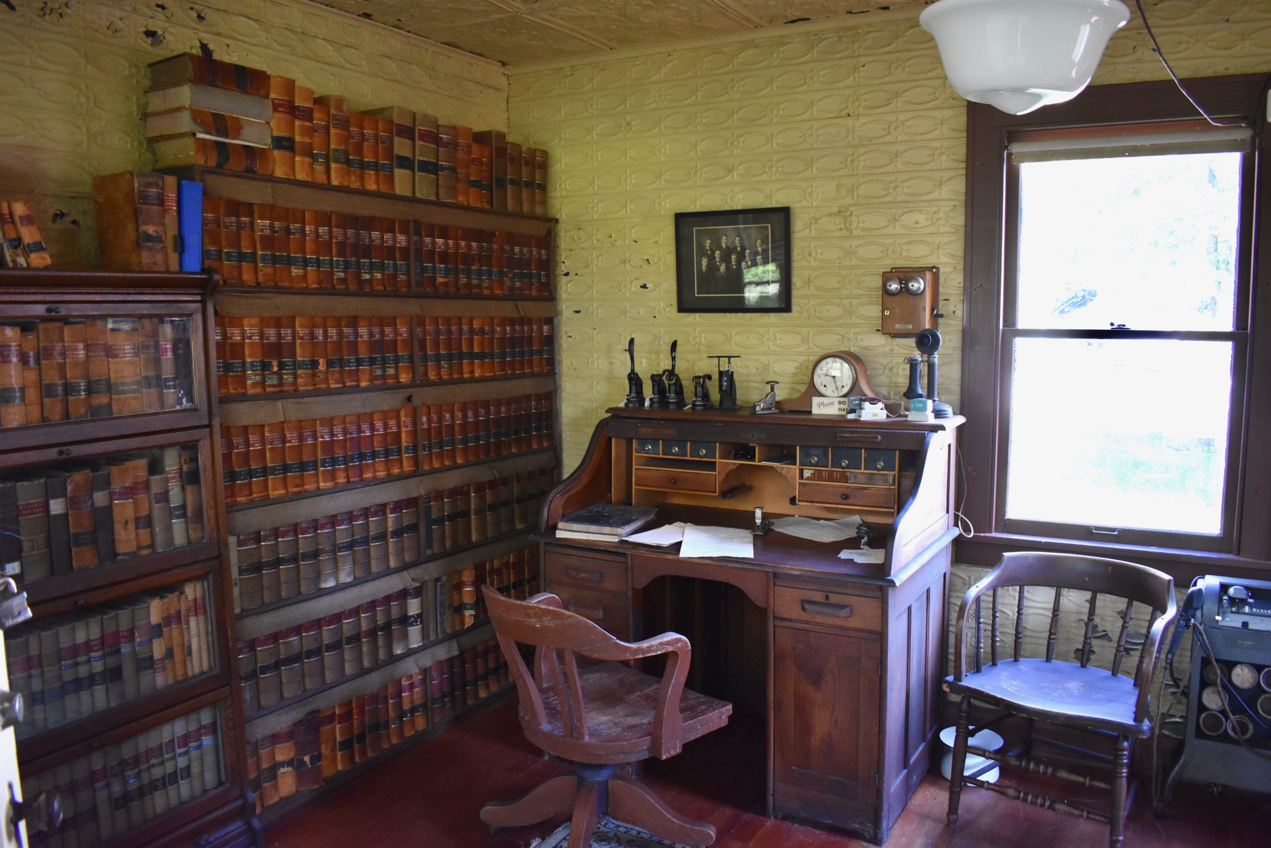 desk with bookshelf to the left