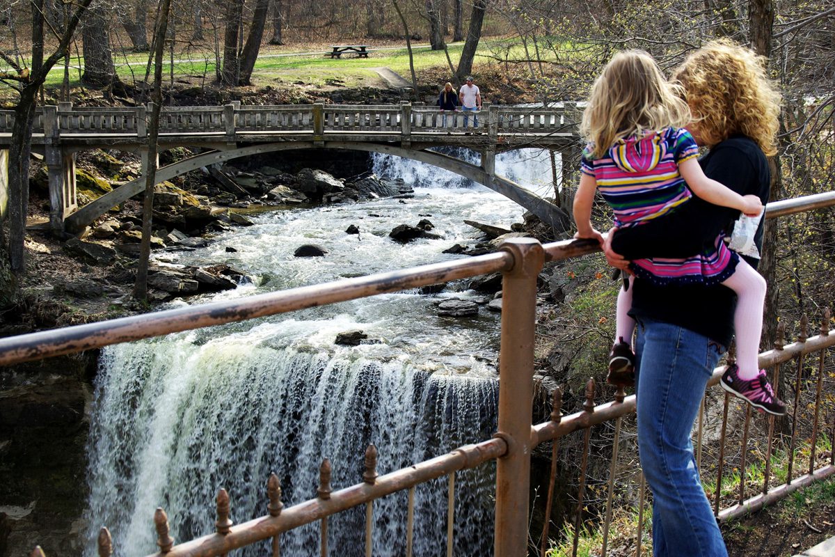 Minneopa State Park-family on bridge by falls