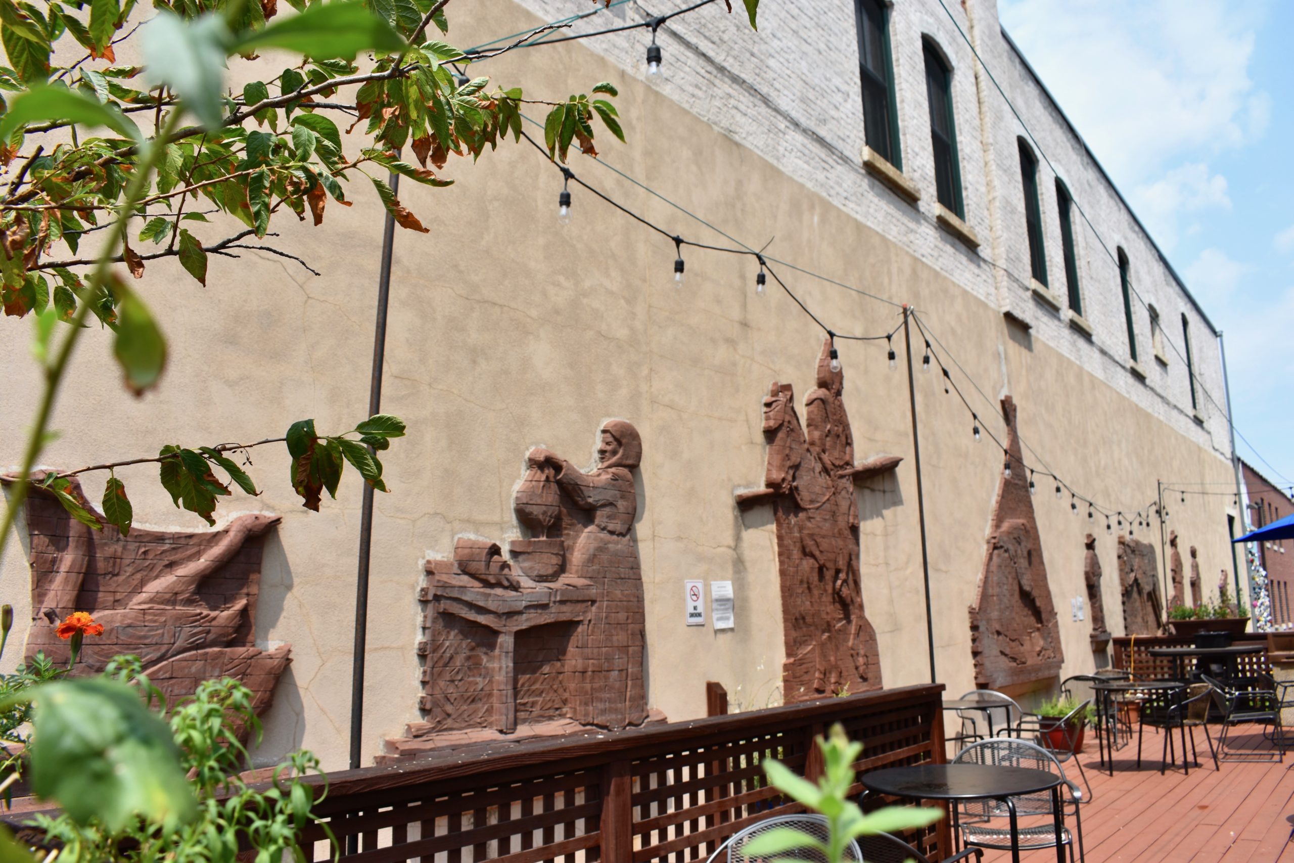 Brick murals and outdoor restaurant seating