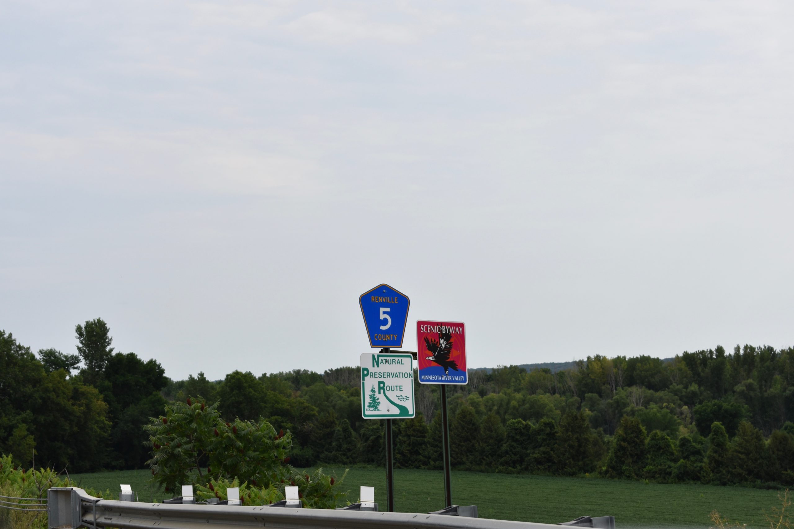 scenic byway sign in foreground. trees in background