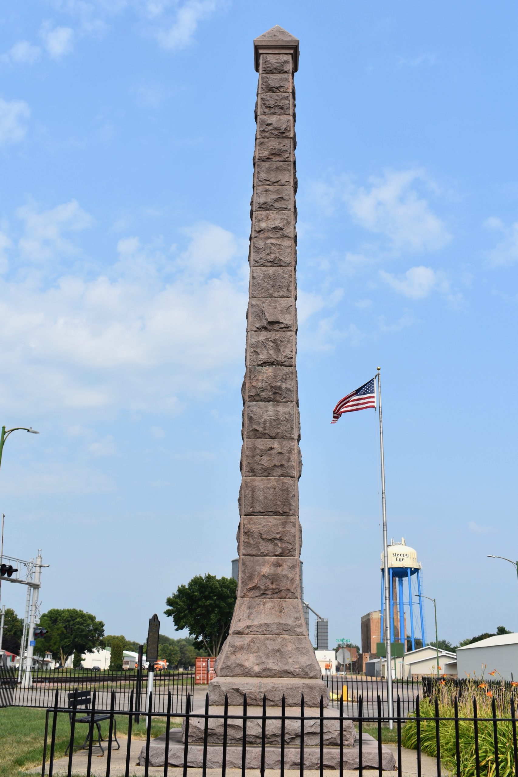 Sleepy Eye monument in foreground. Sleepy Eye water tower in background.