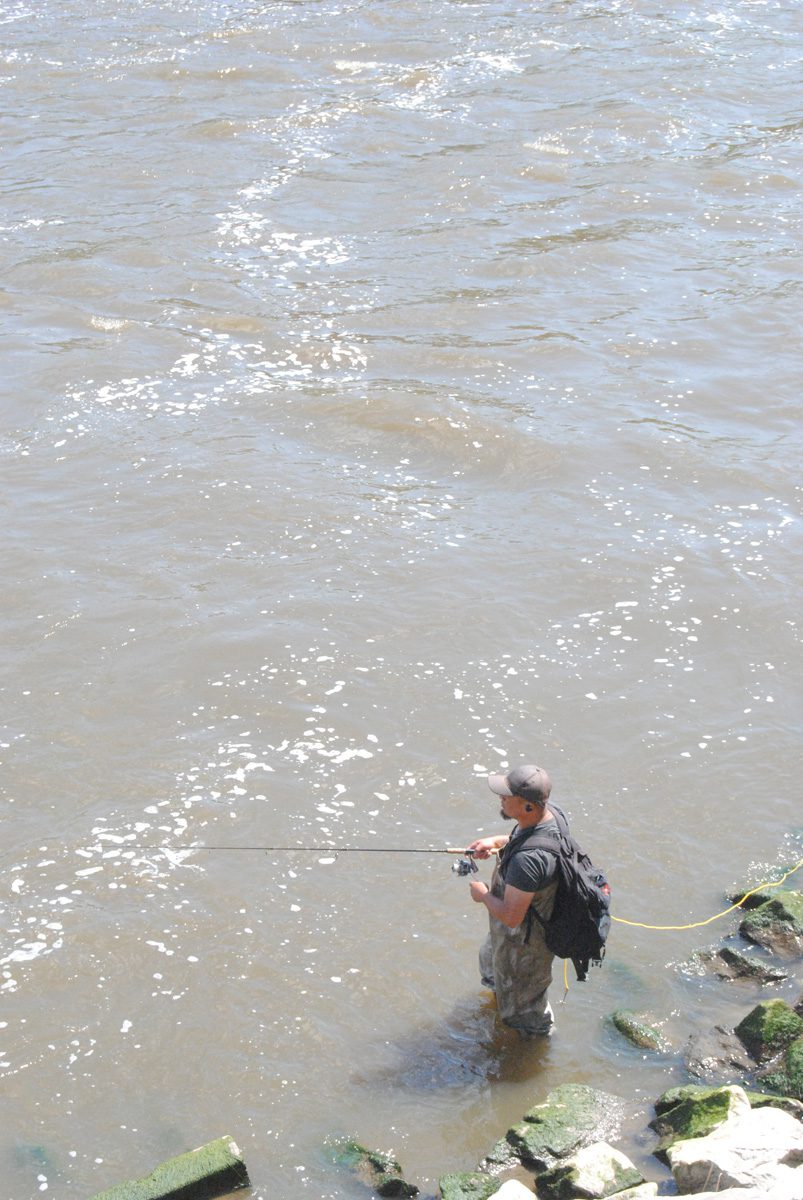 Granite Falls-man fishing in river